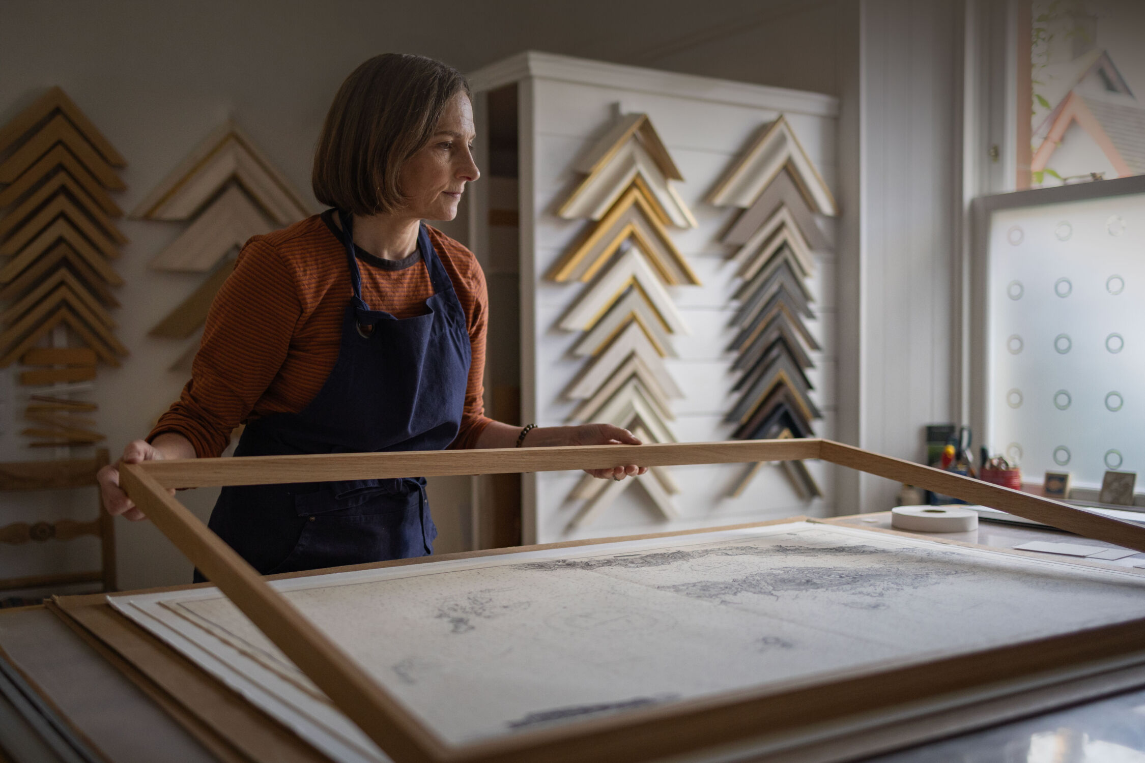 Lucy working on a frame